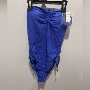 NEW!! W/tag Never Worn
Blue One Piece Swimsuit with Ruching and Adjustable Sides